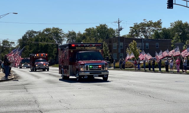 The procession came north up Burnham Ave. in Lansing, passing by Village Hall. (Photo: Melanie Jongsma)