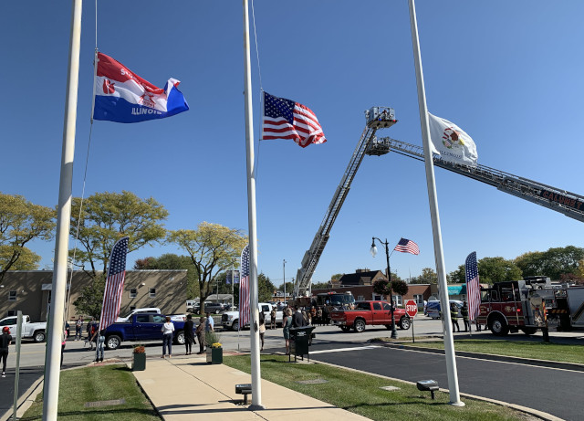 The Munster and Calumet City Fire Towers were raised over Wausau Ave. in front of the South Holland Fire Department in salute. (Photo: Josh Bootsma)