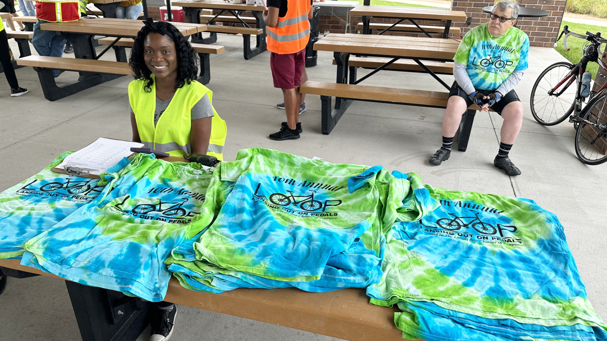 Riders who pre-register get a LOOP t-shirt. Chamber Board member Shauna Craib helped bikers find the size they had ordered. (Photo: Melanie Jongsma)