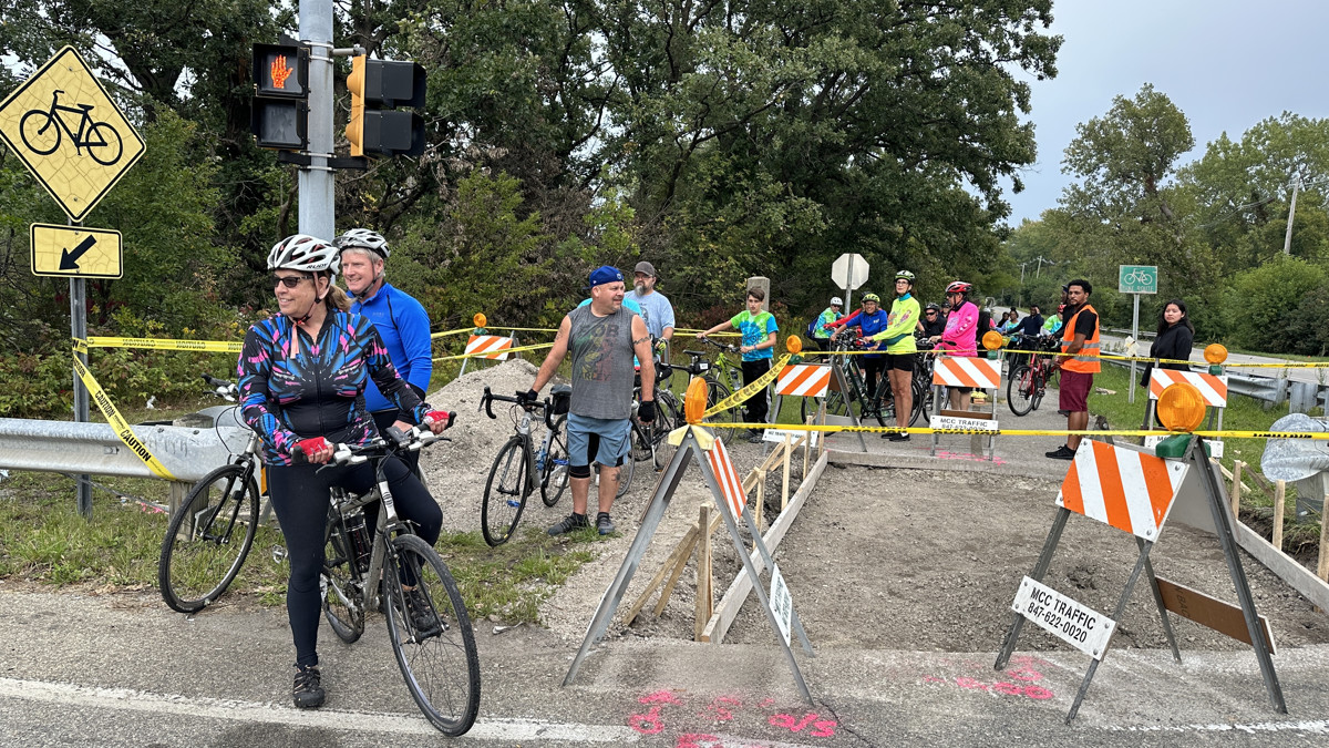 A sidewalk construction project at the intersection of Stony Island and Glenwood-Lansing Road gave the bikers an opportunity to stop and regroup. (Photo: Melanie Jongsma)
